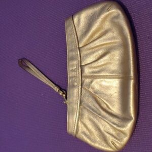 Coach brand large gold wristlet
